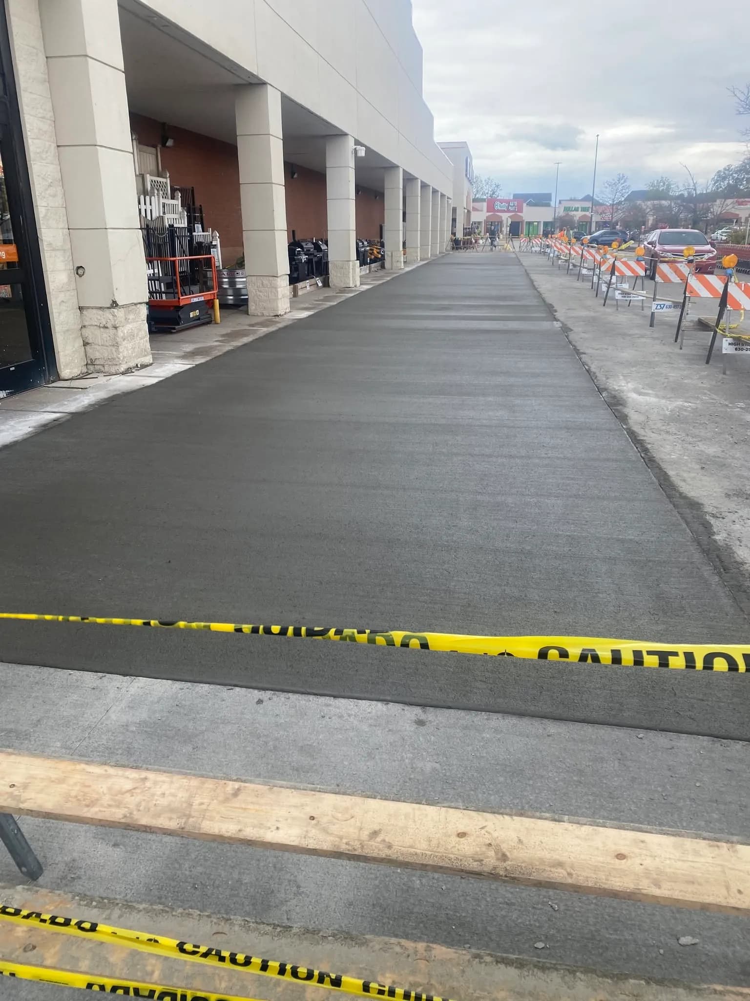 Freshly poured commercial concrete walkway by ORA Concrete in Joliet, IL