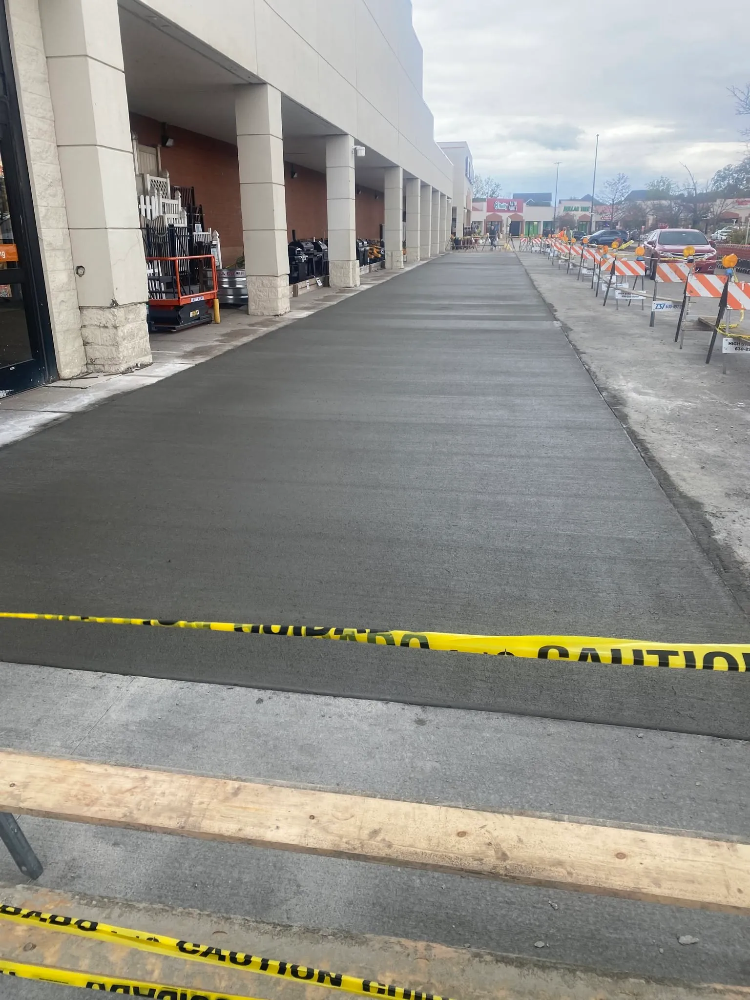 Freshly poured commercial concrete walkway by ORA Concrete in Joliet, IL